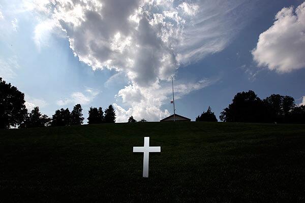 A cross marks the spot where Robert F. Kennedy is buried at Arlington National Cemetery in Arlington, Va. Sen. Edward M. Kennedy will be buried nearby, up the hill from the resting place of President John F. Kennedy.