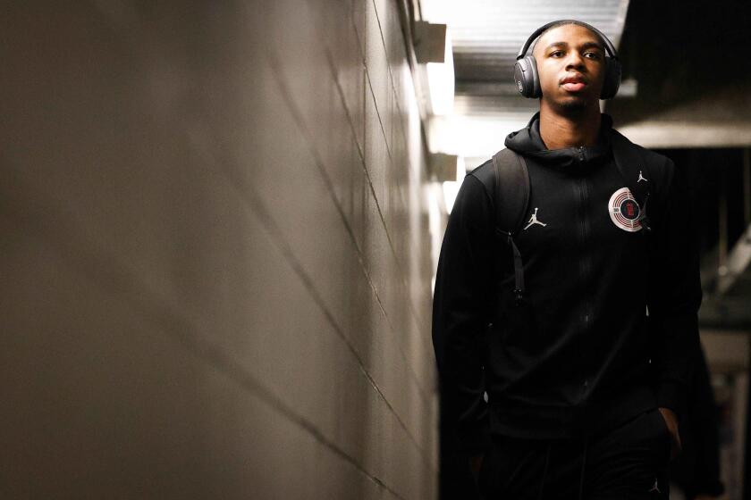 Spokane, WA - March 24: San Diego State guard Lamont Butler (5) walks to the locker room before the Aztecs game against Yale during second round of the NCAA Tournament at Spokane Veterans Memorial Arena on Sunday, March 24, 2024 in Spokane, WA. (Meg McLaughlin / The San Diego Union-Tribune)