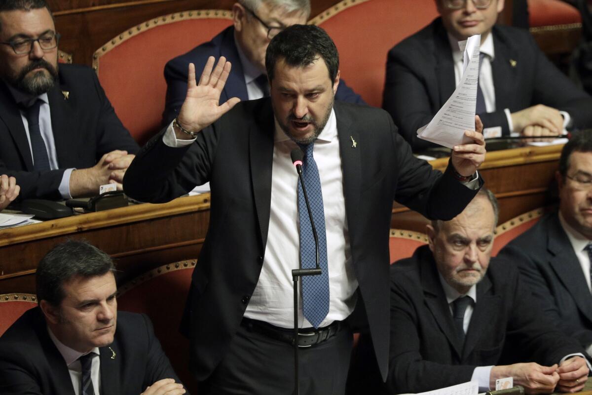 FILE - In this Feb. 12, 2020 file photo, then opposition leader Matteo Salvini speaks at the end of the debate at the Italian Senate on whether to allow him to be prosecuted, as he demands to be, for alleging holding migrants hostage for days aboard coast guard ship Gregoretti instead of letting them immediately disembark in Sicily, while he was interior minister, in Rome. A judge in Sicily on Saturday, April 17, 2021, ordered former Interior Minister Matteo Salvini to stand trial for having refused to let a Spanish migrant rescue ship dock in an Italian port in 2019, keeping the people at sea for days. (AP Photo/Andrew Medichini, file)