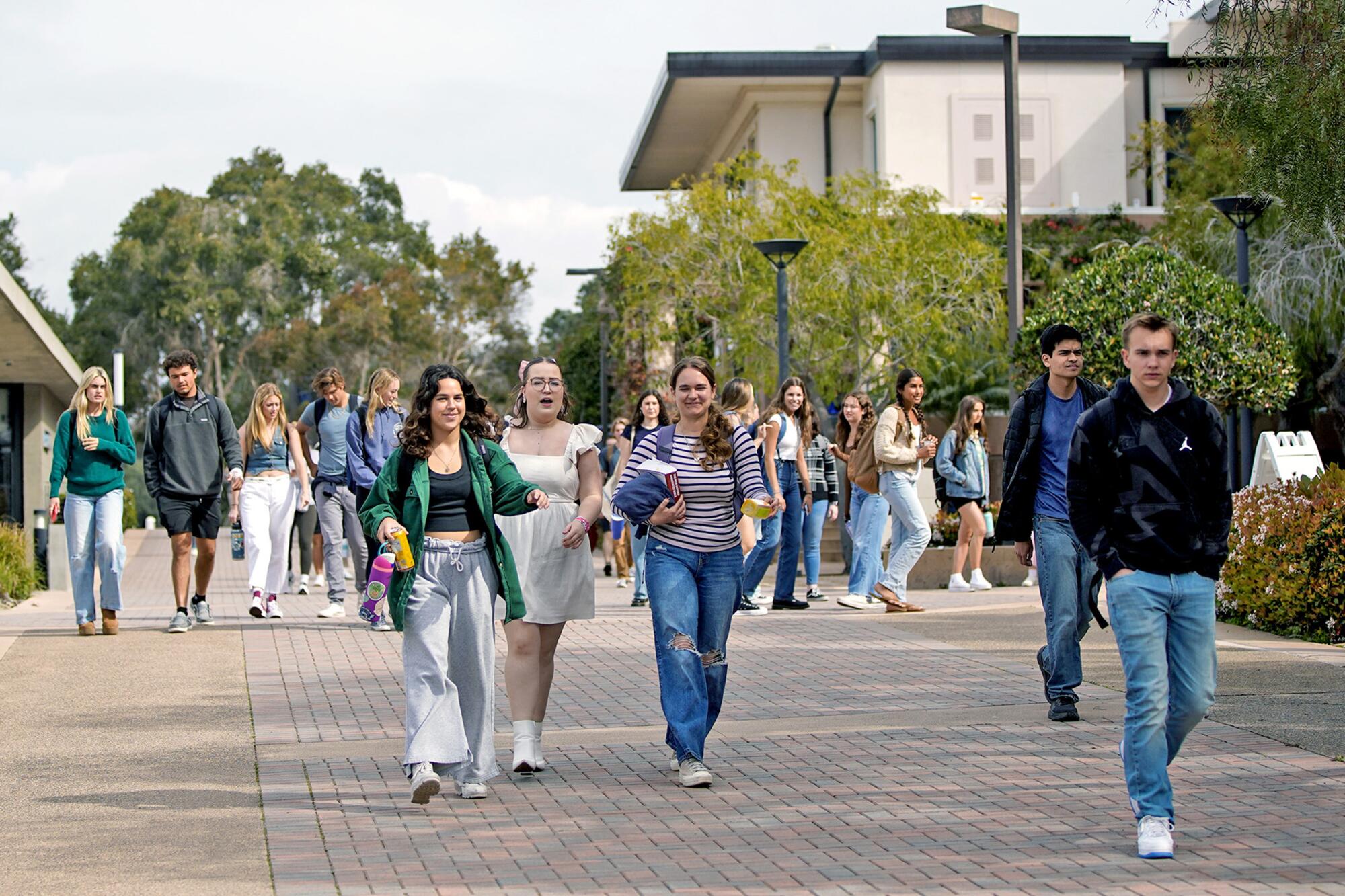 Students walking in the middle of campus in Point Loma on Monday, March 11, 2024.