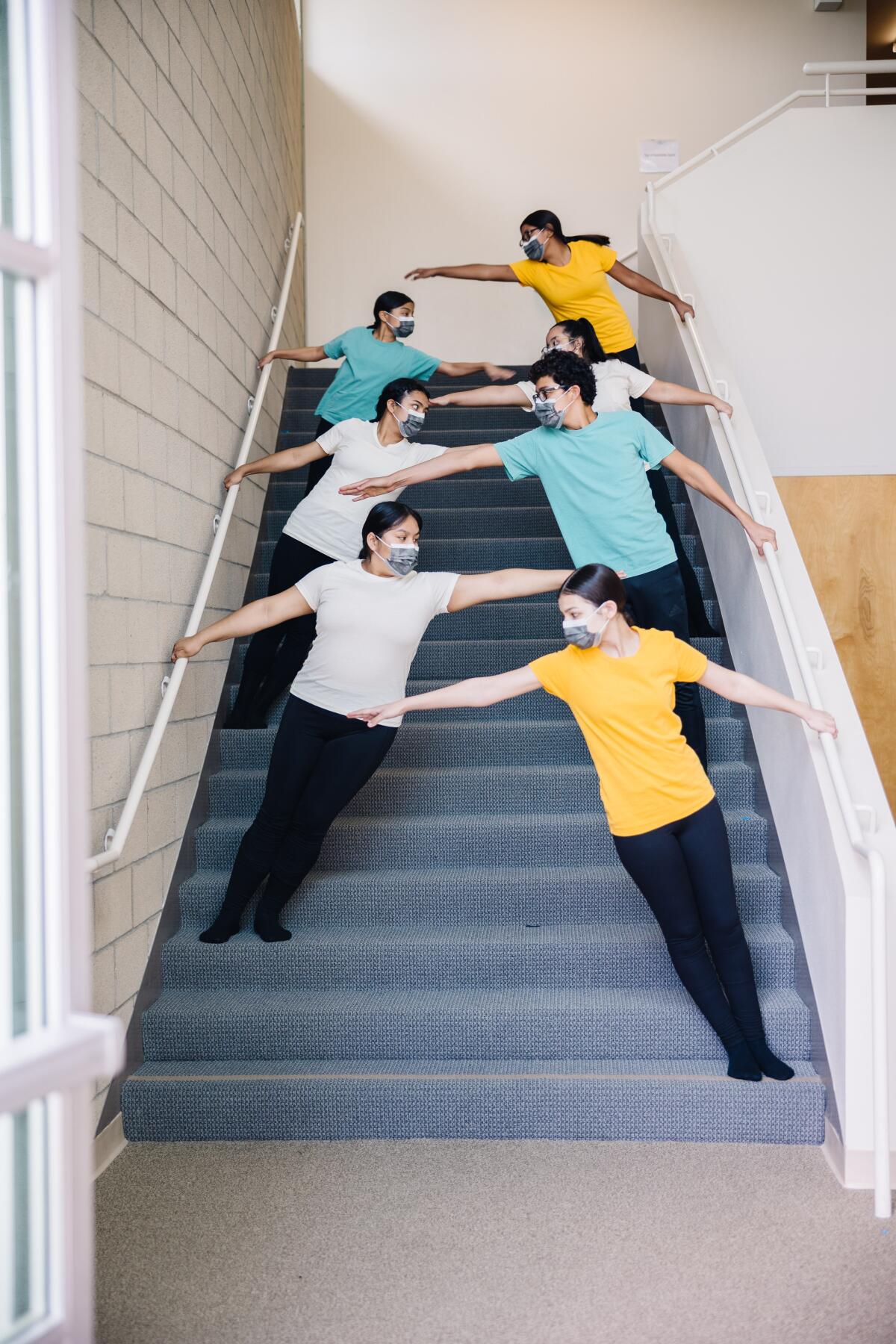 Young dancers rehearse on the stair steps of the Wooden Floor's Main Street location 
