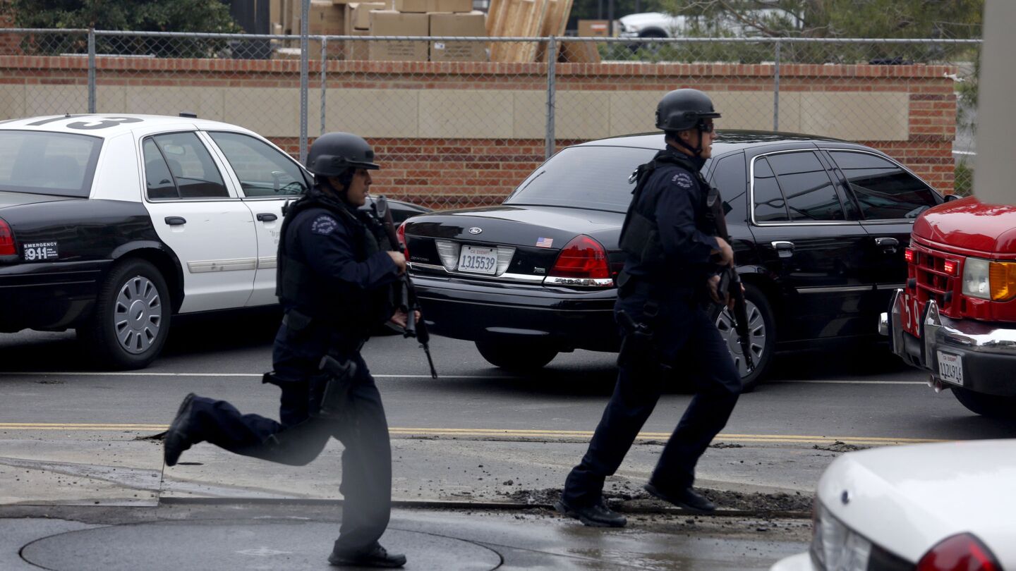 Police rush to the scene of a shooting at UCLA on Wednesday morning.