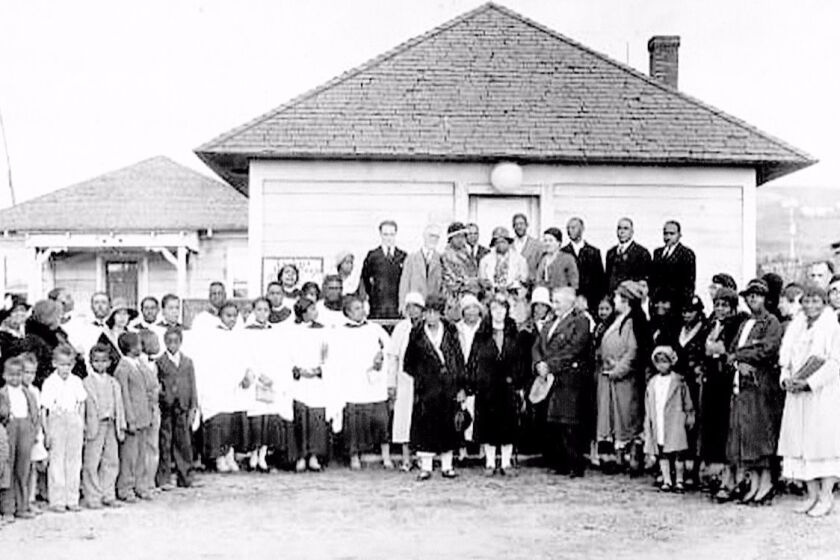 Members of La Jolla Union Mission Church on Cuvier Street pose in front of La Jolla’s first African-American church, on the same location where Prince Chapel by the Sea African Methodist Church stands today.