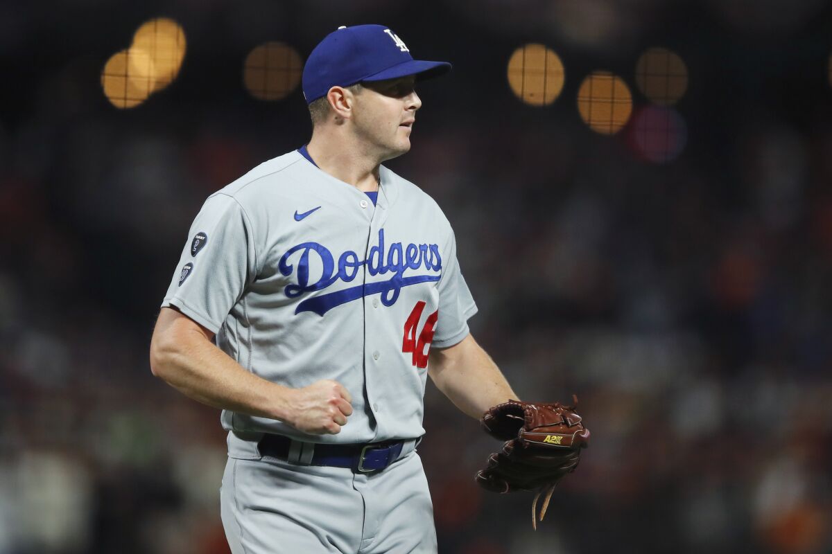 Dodgers pitcher Corey Knebel reacts during the seventh inning of Game 2 of the NLDS against the Giants.