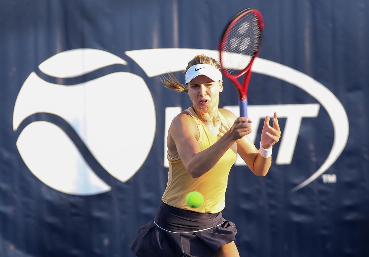 Orange County Breakers' Genie Bouchard makes a forehand return against the Philadelphia Freedoms in a World Team Tennis match on Tuesday at Palisades Tennis Club in Newport Beach.