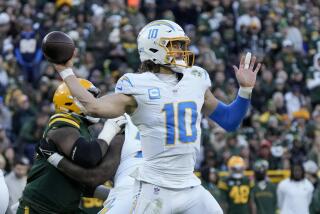 Chargers quarterback Justin Herbert throws a pass against the Green Bay Packers.