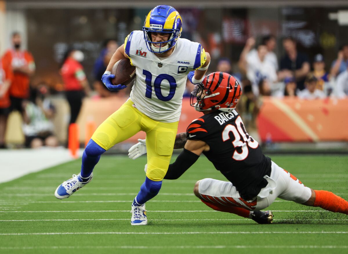 Rams wide receiver Cooper Kupp breaks a tackle to get past Cincinnati Bengals safety Jessie Bates.