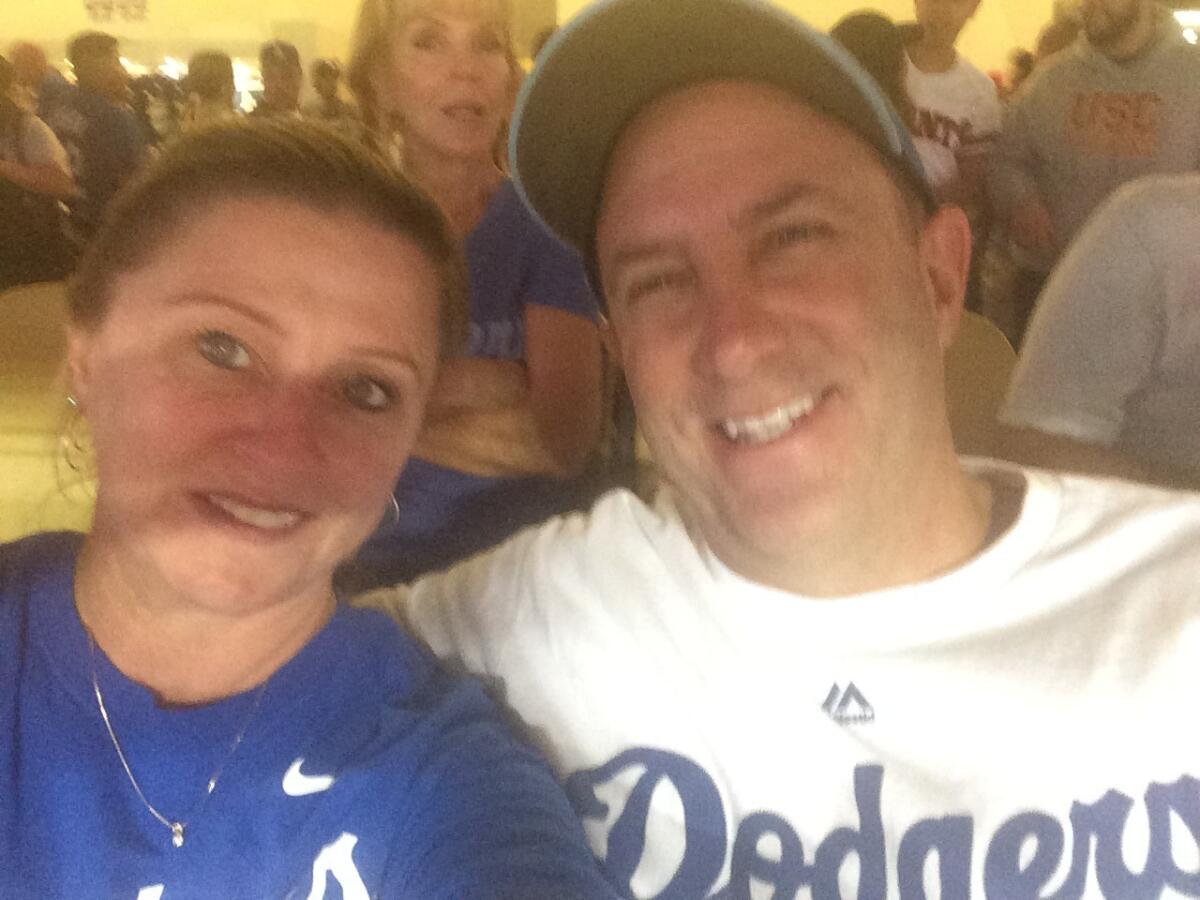 Rich Heisen and his wife, Kerry, attend a Dodgers game in September.