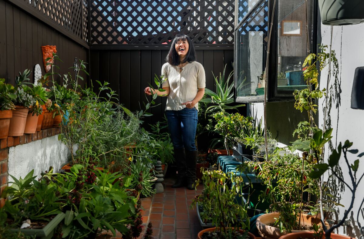 Barbara Chung surrounded by her plants.