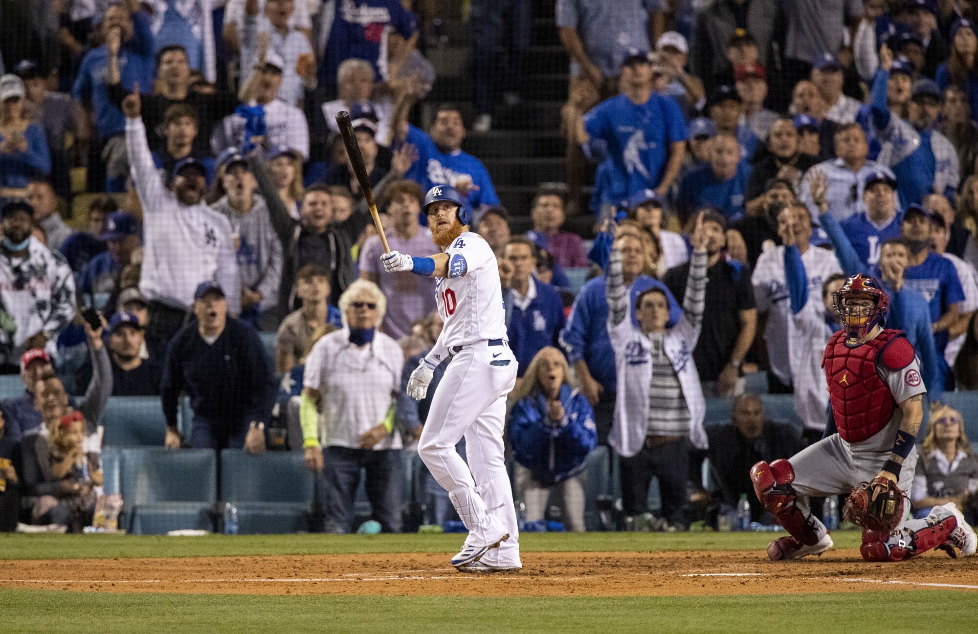 Los Angeles Dodgers third baseman Justin Turner (10) watches his solo homer clear the left field wall.