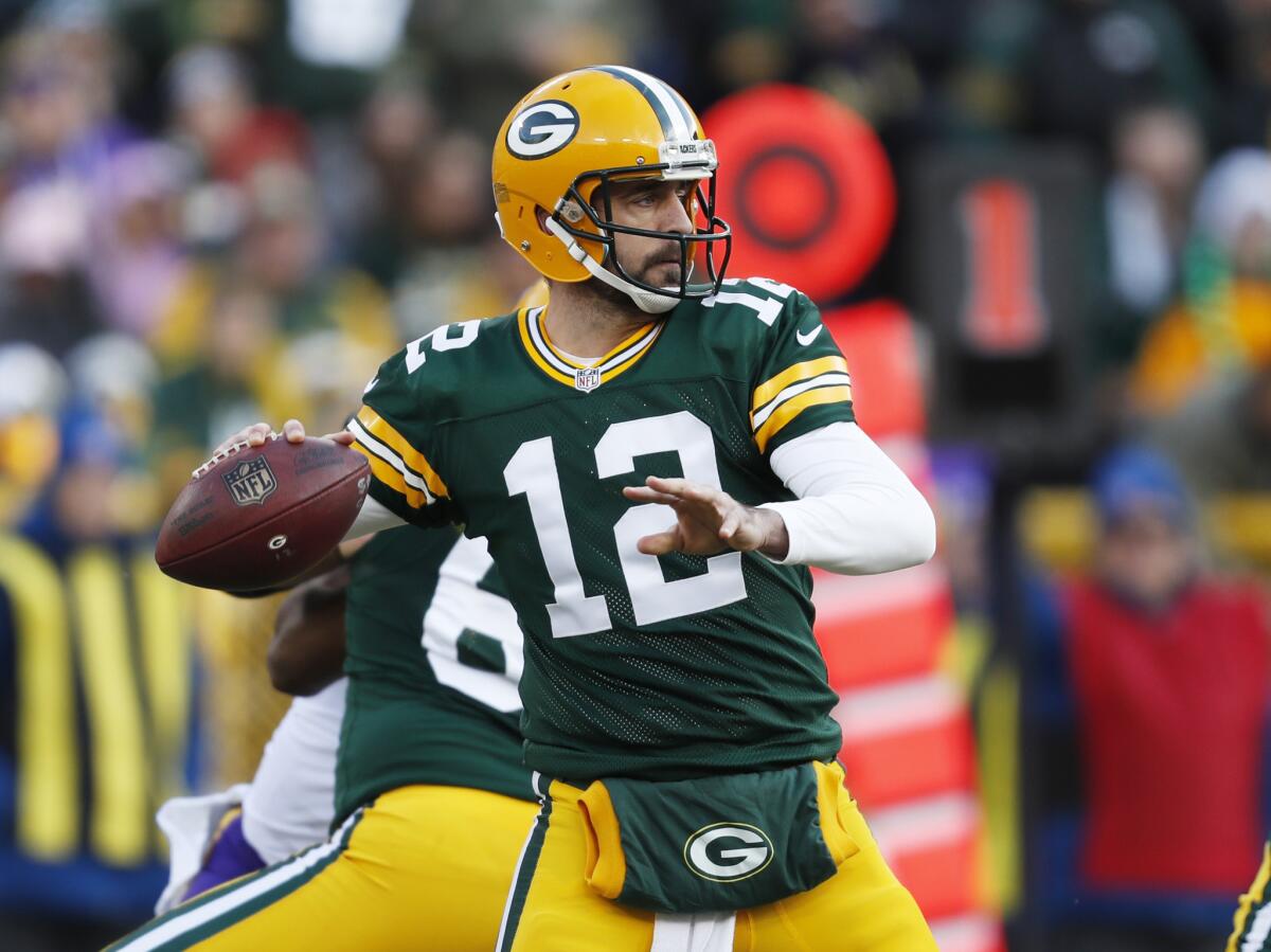 Green Bay Packers' quarterback Aaron Rodgers throws during an NFL football game against the Minnesota Vikings this month. The Packers meet the Detroit Lions in "Sunday Night Football" on Jan. 1.