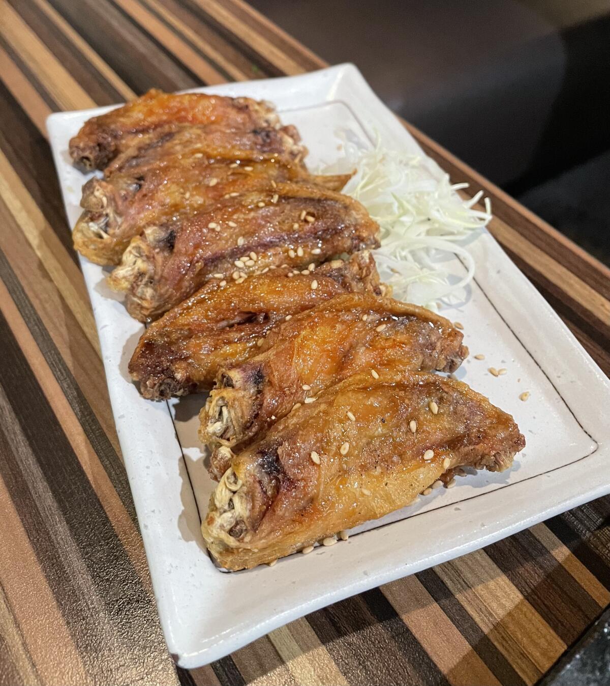 Tebasaki wings, brushed with signature sauce at Furaibo, a Japanese pub with a new location in Santa Ana.