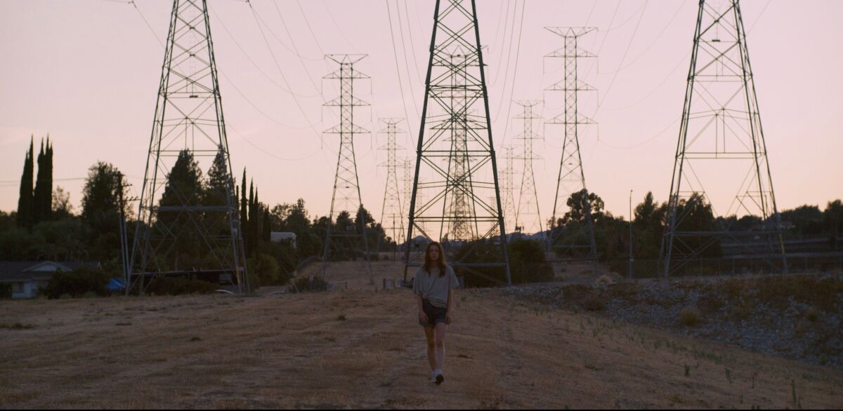 Seventeen-year-old Lea (Lily McInerny) looks for an escape from her humdrum reality in "Palm Trees and Power Lines."
