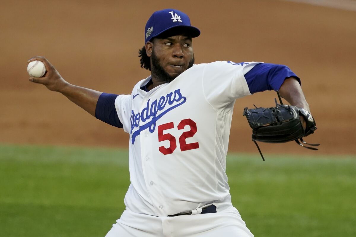 Dodgers relief pitcher Pedro Baez throws against the Atlanta Braves.