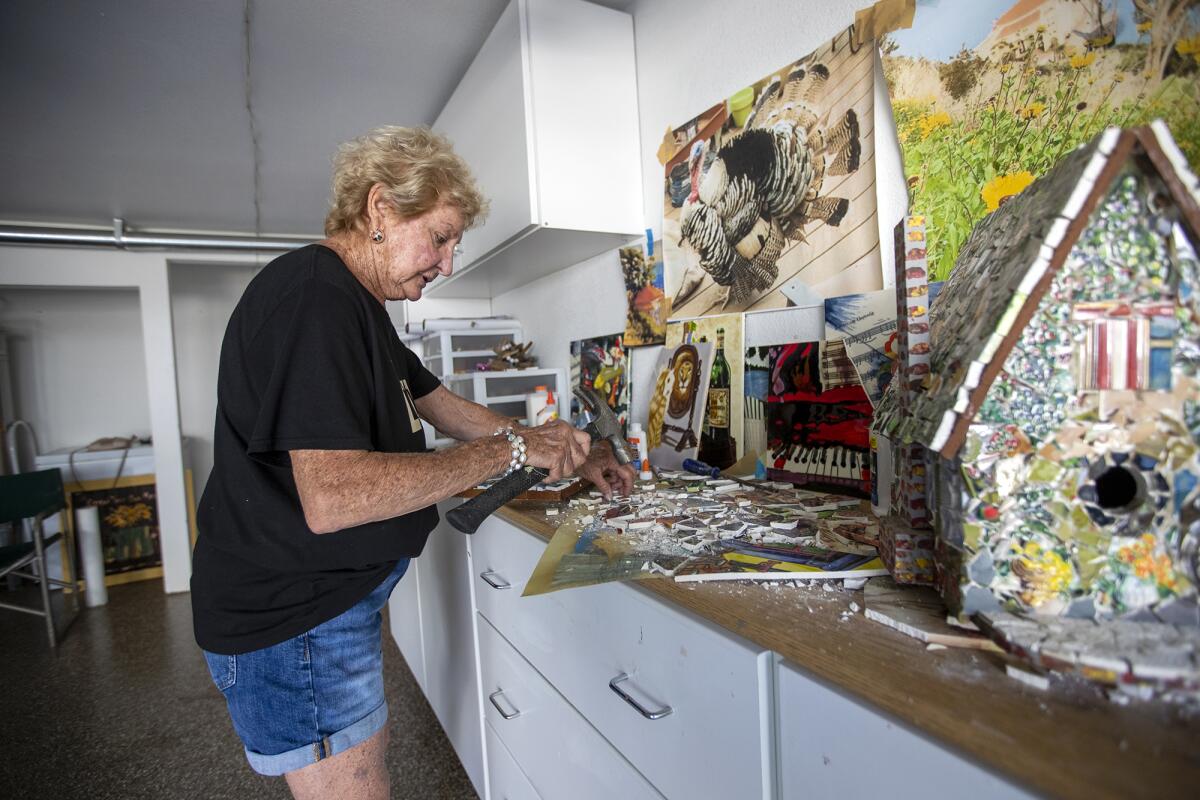 Robbie Britvich, 82, works on her mosaic art in the garage of her Newport Beach home on Monday.