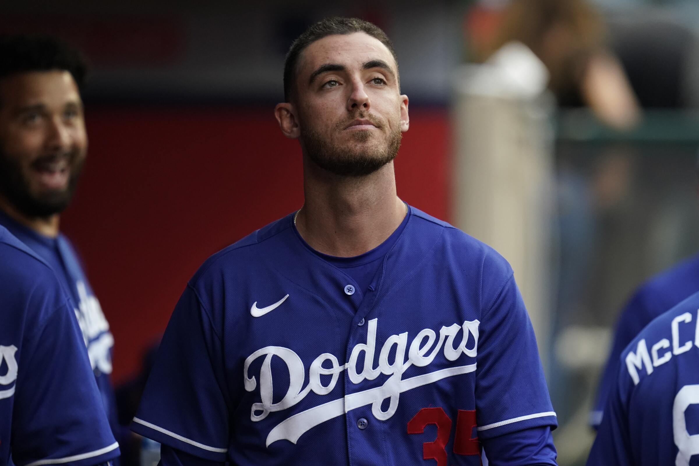 Dodgers center fielder Cody Bellinger walks through the dugout during a game against the Angels.
