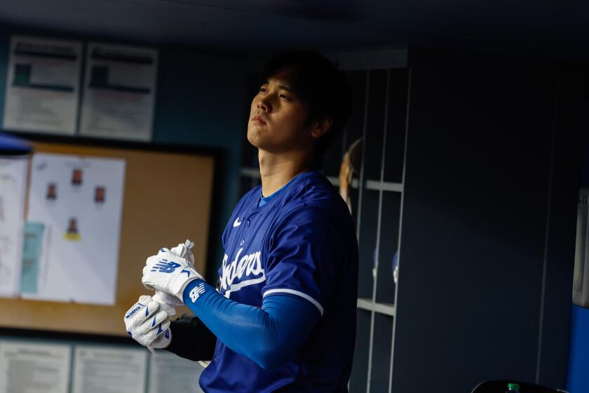 Los Angeles, CA - March 25: Shohei Ohtani gets ready to bat during the Los Angeles Dodgers vs. Los Angeles Angels spring training game at Dodger Stadium on Monday, March 25, 2024 in Los Angeles, CA. (Jason Armond / Los Angeles Times)