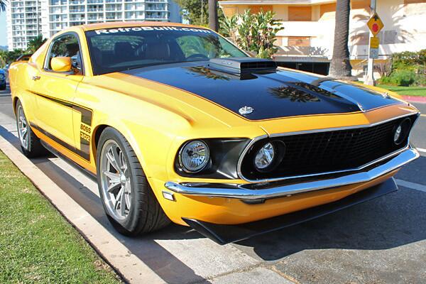What you're looking at is a brand-new Ford Mustang GT, powered by the Coyote 5.0-liter V-8 engine. Sitting on top of the donor car is a fiberglass body kit, designed to replicate the look of a 1969 Mustang Boss 302.