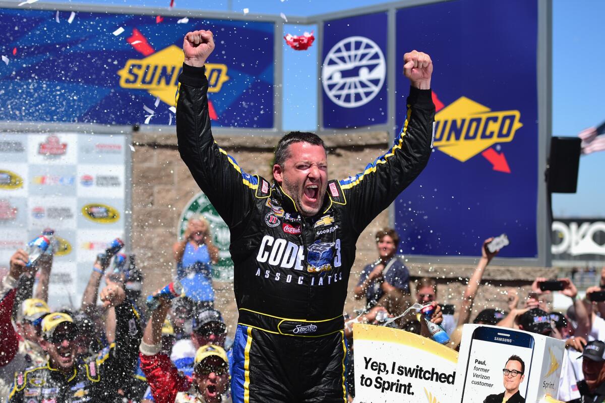 Tony Stewart, driver of the #14 Code 3 Assoc/Mobil 1 Chevrolet, celebrates in victory lane after winning the Toyota/Save Mart 350 at Sonoma Raceway on June 26.