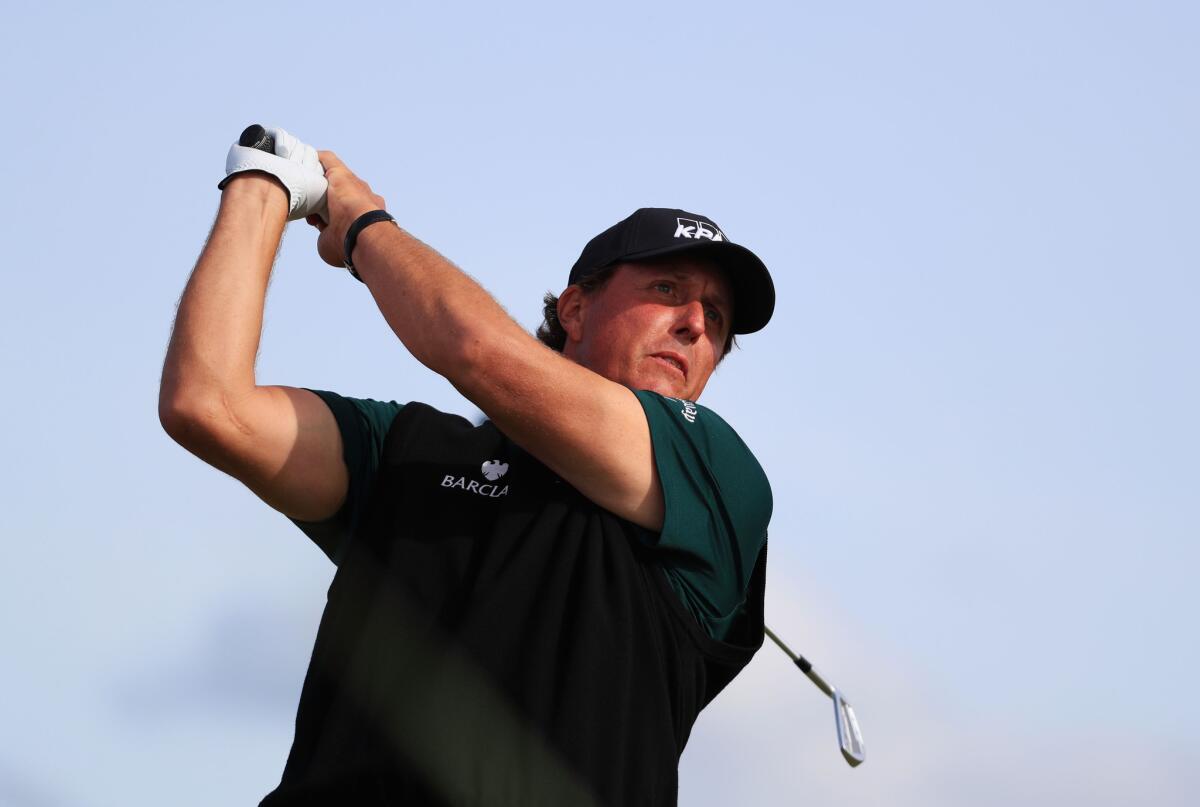 Phil Mickelson plays a shot during the first round of the British Open.