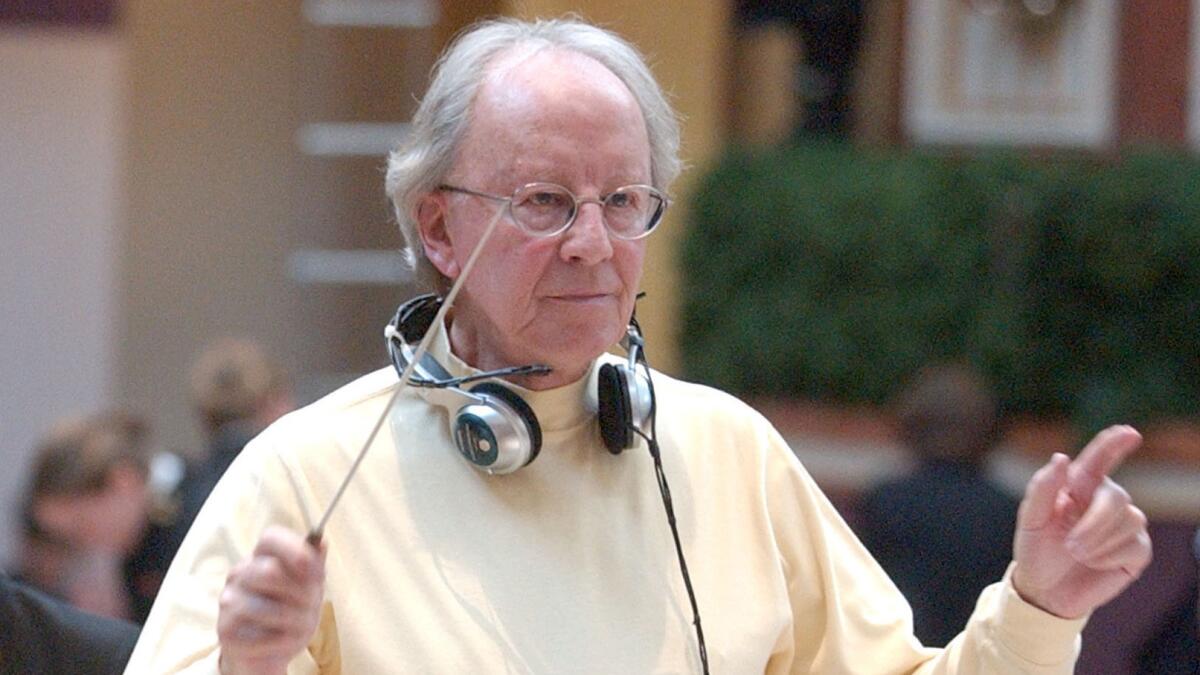 Musical director Ian Fraser works with the an orchestra during rehearsals for TNT's "Christmas in Washington" concert Dec. 14, 2002.