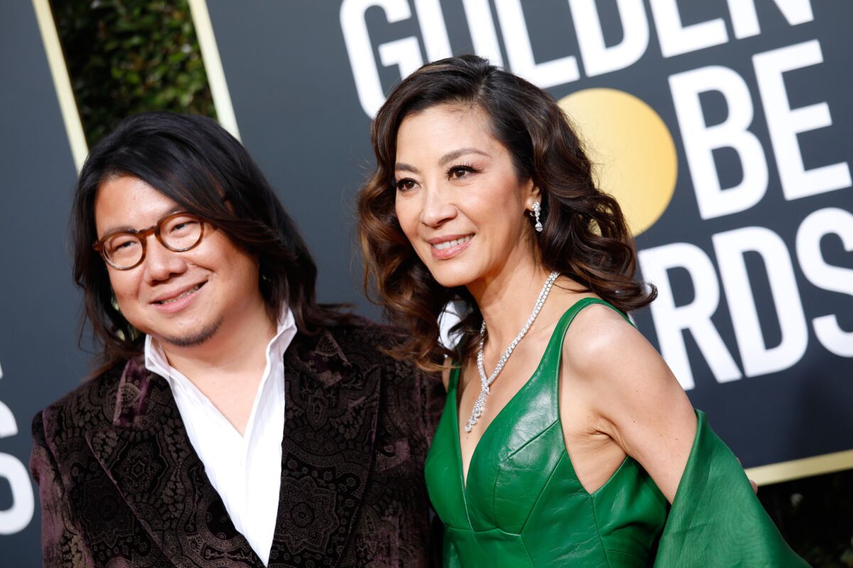 Author Kevin Kwan, left, and Michelle Yeoh at the 76th Golden Globes in Beverly Hills.