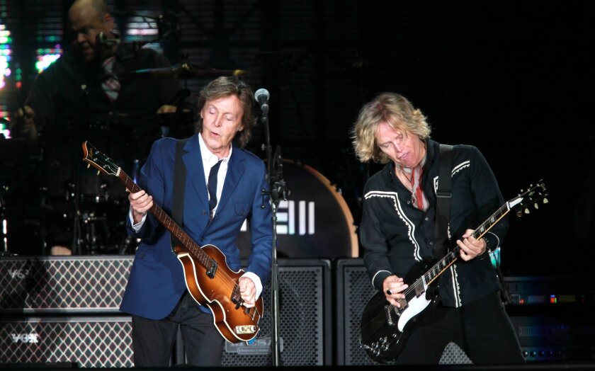 Paul McCartney is shown in action on his 2014 tour, which included his first San Diego concert in 38 years.