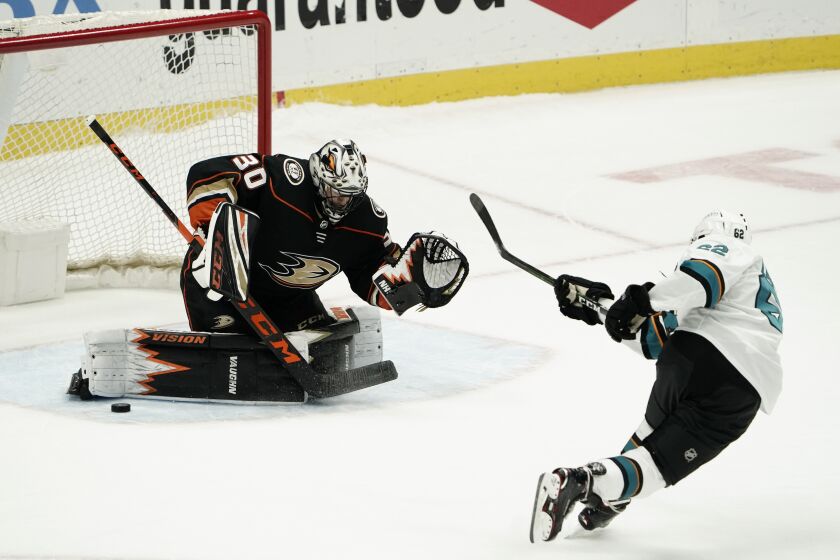 Ducks goalie Ryan Miller stops a shot by San Jose Sharks' Kevin Labanc during the shootout Feb. 6, 2021, in Anaheim.