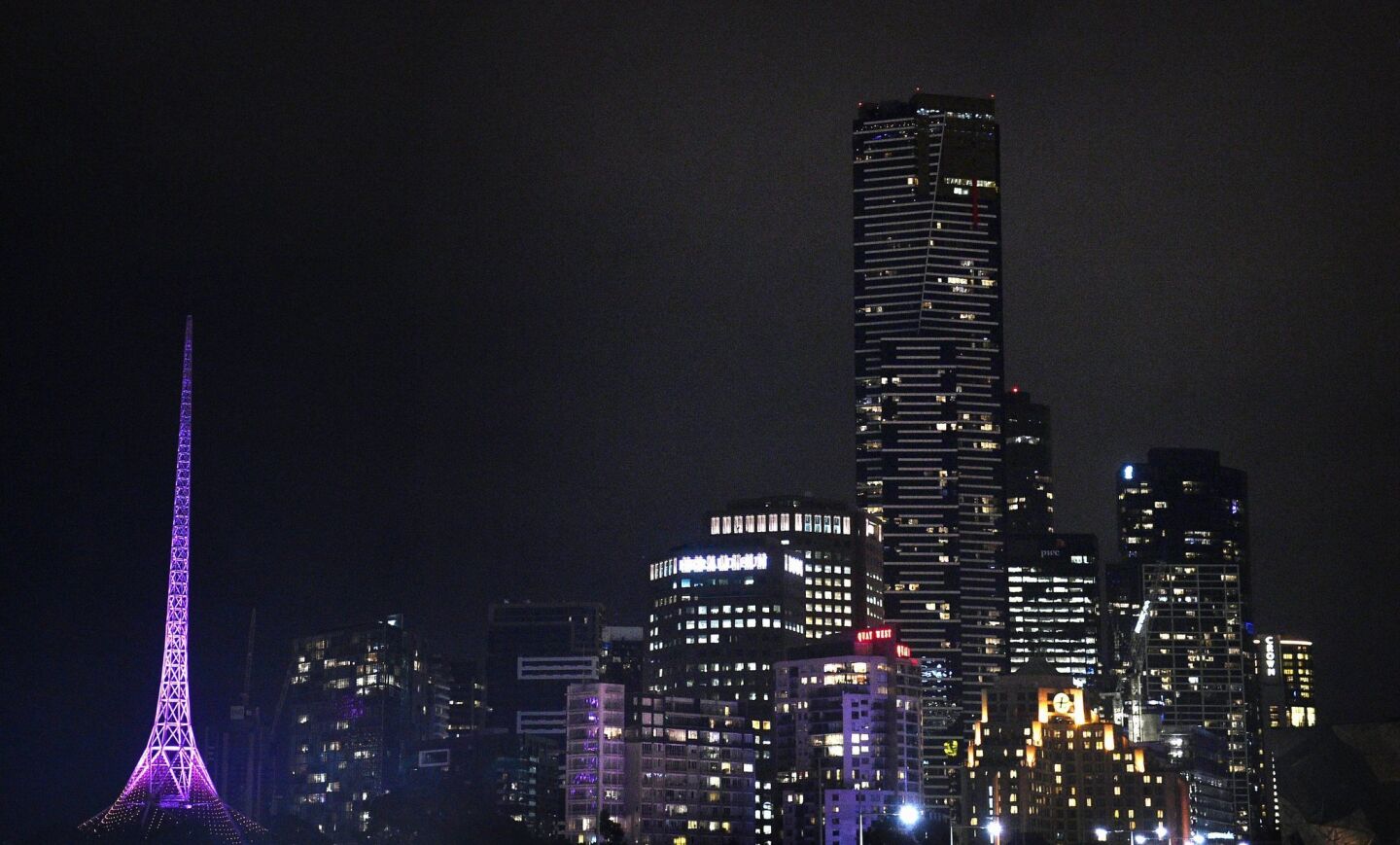 The Melbourne Arts Centre spire is lit in purple to honor Prince in Melbourne, Australia.