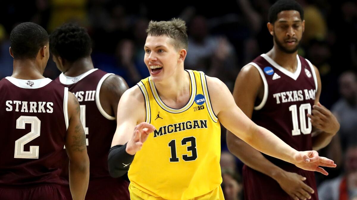 Michigan's Moritz Wagner celebrates after making a three-pointer against Texas A&M during the first half of their Sweet 16 game on Thursday.