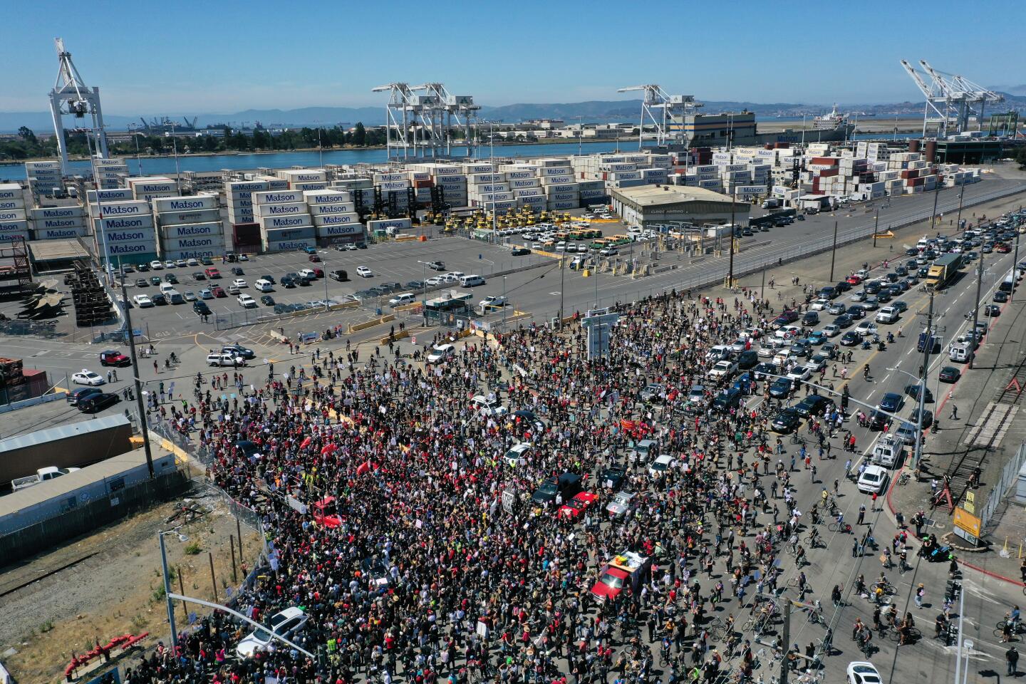 Thousands of union longshoremen and activists attend a Juneteenth rally and march near the port in Oakland.