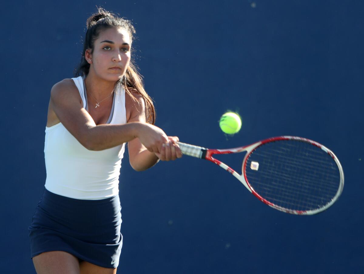 Crescenta Valley High School tennis player Sarine Auvazian returns the ball in game vs. Glendale High School, at home in La Crescenta on Tuesday, Oct. 22, 2019.