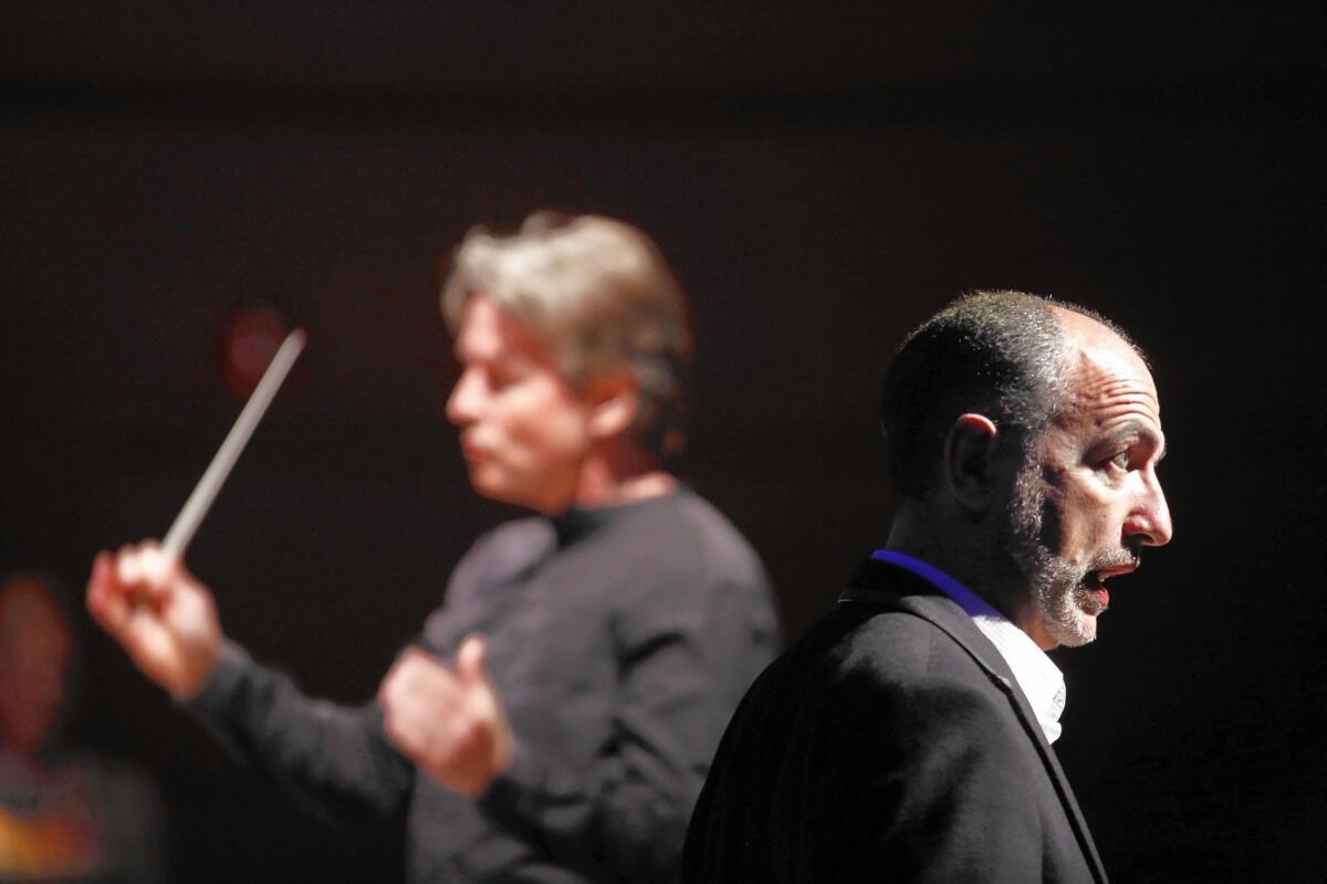 Debussy's Pelleas et Melisande featured Esa-Pekka Salonen, left, conducting the L.A. Philharmonic at the Disney Concert Hall on Friday evening. Stephan Degout, a baritone, was one of the singers who performed.