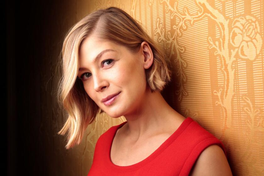 "Gone Girl" star Rosamund Pike is in talks to join Christian Bale in "The Deep Blue Good-by."