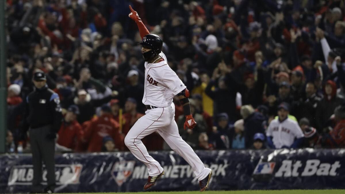 Boston's Eduardo Nunez reacts after hitting a three-run home run during the seventh inning of Game 1 of the World Series.