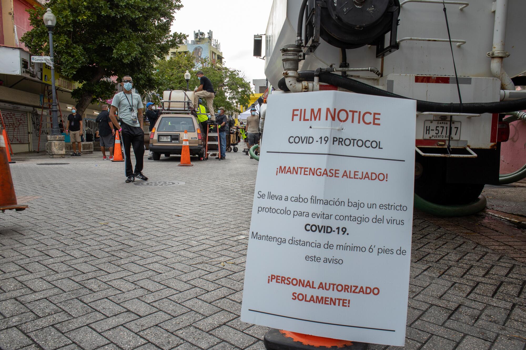 A COVID-19 warning sign on the set of "Simone" in San Juan, Puerto Rico.