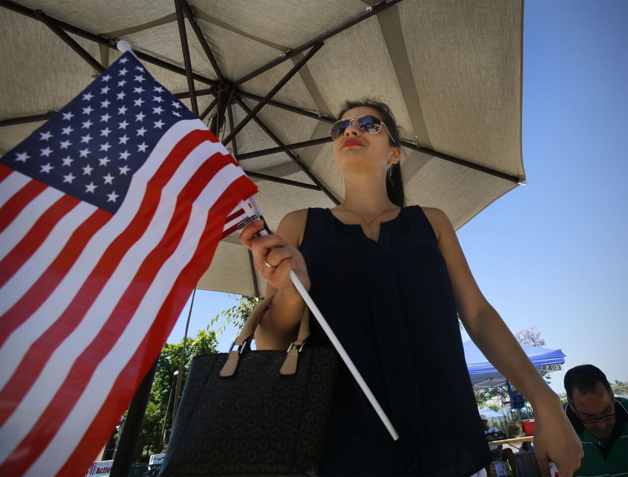 Abby Bogels originally from New Zealand was one of about 100 people from about 54 countries took the Oath of Allegiance to the United States of America in a naturalization ceremony held in Centennial Plaza near El Cajon City Hall to kickoff El Cajon's, America on Main Street festivities.