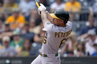Oakland Athletics' Jace Peterson doubles off Pittsburgh Pirates starting pitcher Roansy Contreras, driving in two runs, during the first inning of a baseball game in Pittsburgh, Wednesday, June 7, 2023. (AP Photo/Gene J. Puskar)
