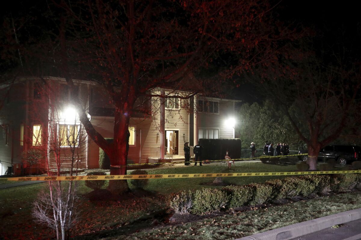 Police work the scene of a residence in Monsey, N.Y., early Sunday, after a stabbing during a Hanukkah celebration Saturday.