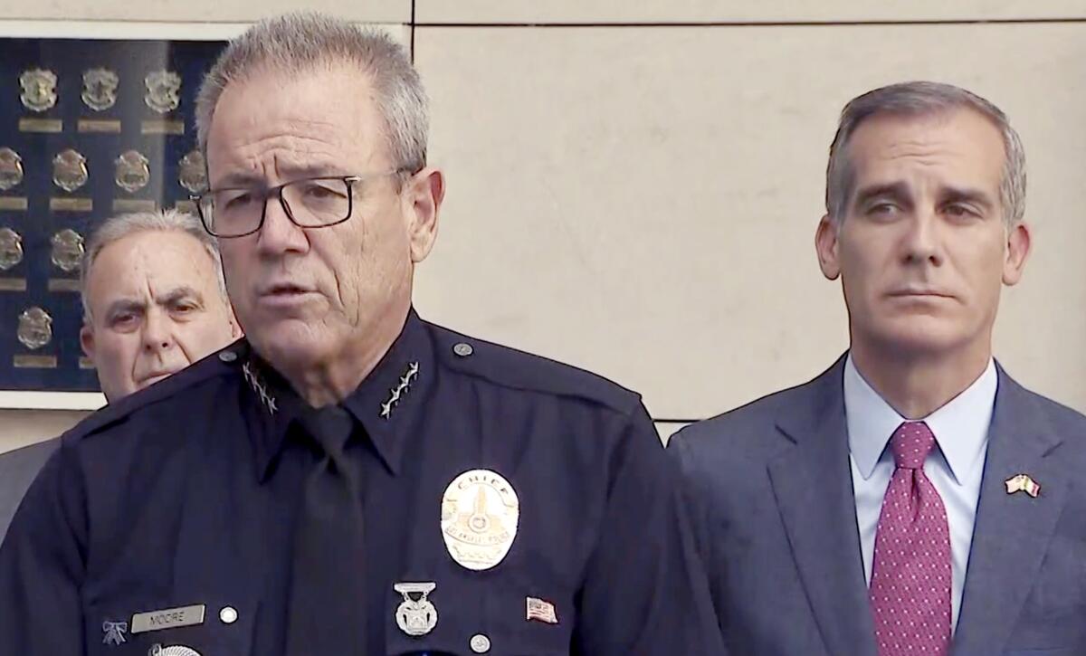 LAPD Chief Michel Moore speaks at a news conference with Mayor Eric Garcetti.