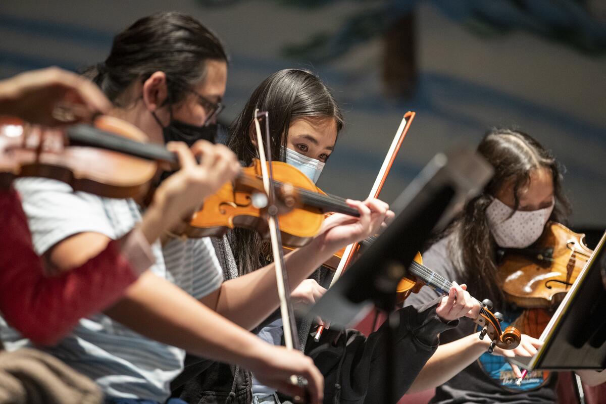 Students in the HBAPA Orchestra rehearse for the upcoming concert "Sounds of the Season" on Tuesday.