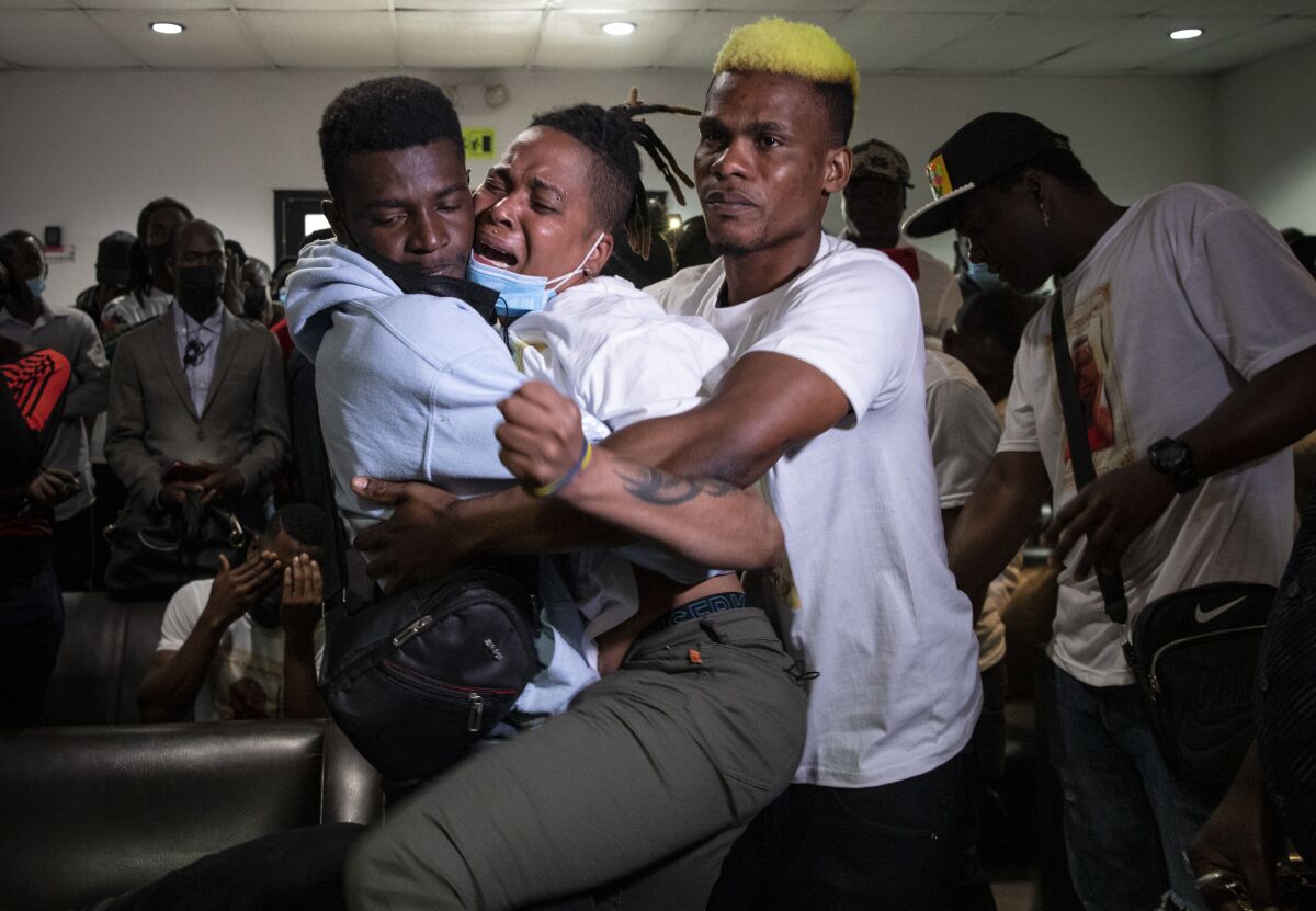 Union-Tribune journalists win top prizes in state competition 6 Eldyne Archangel, center, mourns the loss of her brother