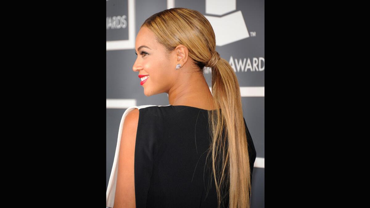 Beyonce's trend-setting style at the 2013 Grammays included a long blond, straight ponytail.