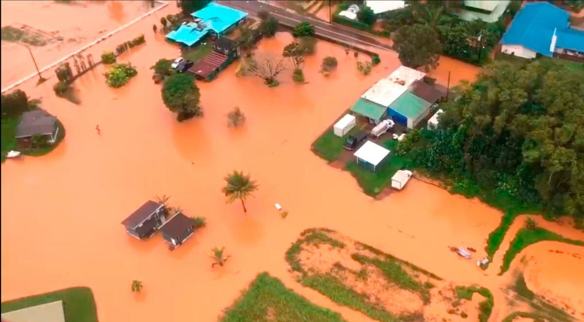 Floodwaters on the Hawaiian island of Kauai turned orange, a sign of the high iron content in the volcanic soil.