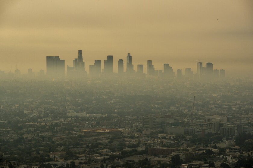 Smoke obscures the Los Angeles skyline.
