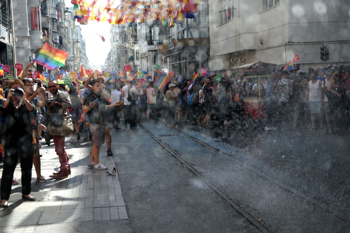 Turkish riot police use water cannons to disperse people taking part in a gay pride rally in Istanbul on June 28.