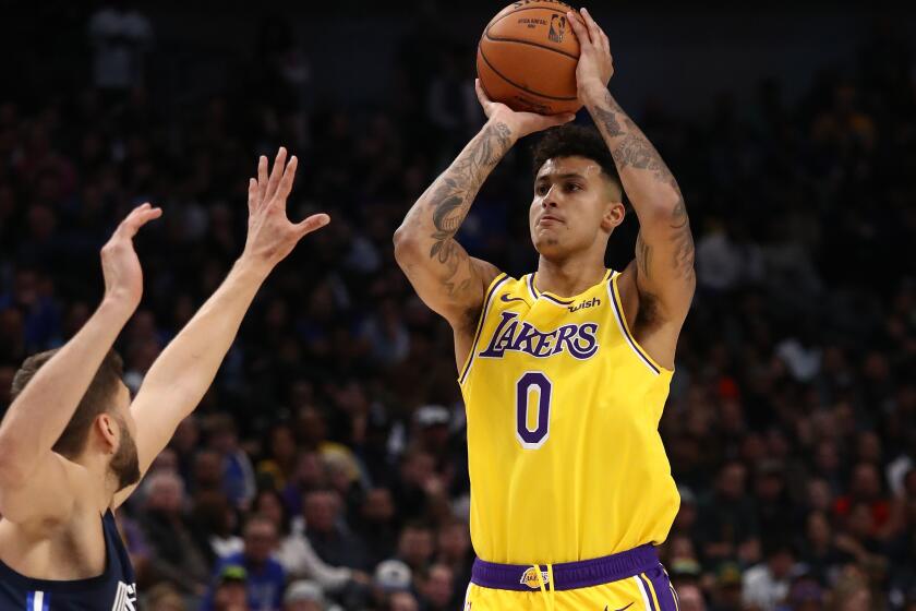 Lakers forward Kyle Kuzma pulls up for a jump shot against the Mavericks during a game Nov. 1, 2019, in Dallas.