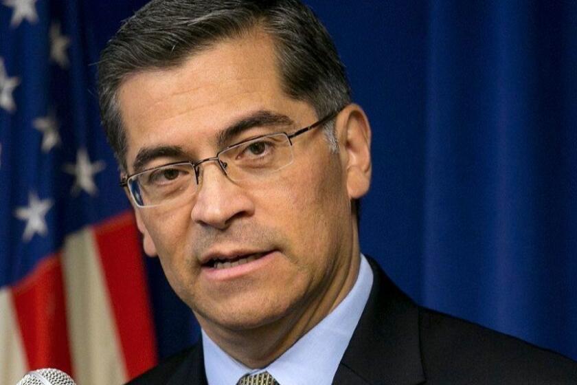 FILE - In this Jan. 24, 2018, file photo California Attorney General Xavier Becerra talks during a news conference in Sacramento, Calif. Becerra has filed a lawsuit against President Donald Trump's emergency declaration to fund a wall on the U.S.-Mexico border. Becerra released a statement Monday, Feb. 18, 2019, saying 16 states - including California - allege the Trump administration's action violates the Constitution. (AP Photo/Rich Pedroncelli, File)