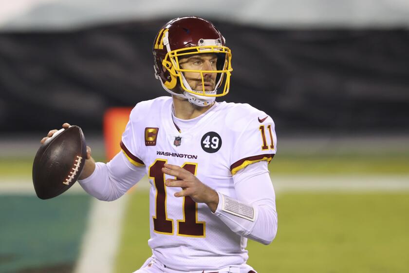 FILE - Washington Football Team quarterback Alex Smith (11) is shown in action against the Philadelphia Eagles.