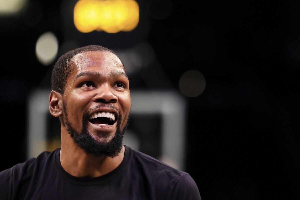 Brooklyn Nets forward Kevin Durant (7) smiles before the start of an NBA basketball game against the Oklahoma City Thunder, Thursday, Jan. 13, 2022, in New York. (AP Photo/Jessie Alcheh)